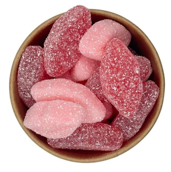 A bowl filled with pinkish candy-coated chocolates, likely to be Fizzy Lips candies.